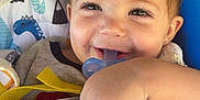 Rylan joined the competition — help win amazing prizes! baby, child, pacifier, smiling, happy, blanket, swing, toddler, face, hand, hair, indoor, comfort, cute, playful, infant, clothing, seat, closeup, joy