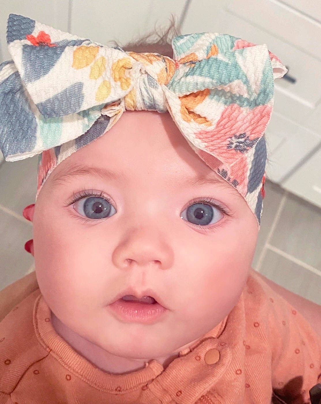 Esmé joined the competition — help win amazing prizes! baby, baby_toddler_clothing, cap, cheek, child, computer_keyboard, costume_hat, eyelash, fashion_accessory, hairstyle, hat, head, headgear, headpiece, headwear, iris, person, personal_protective_equipment, pink, sleeve