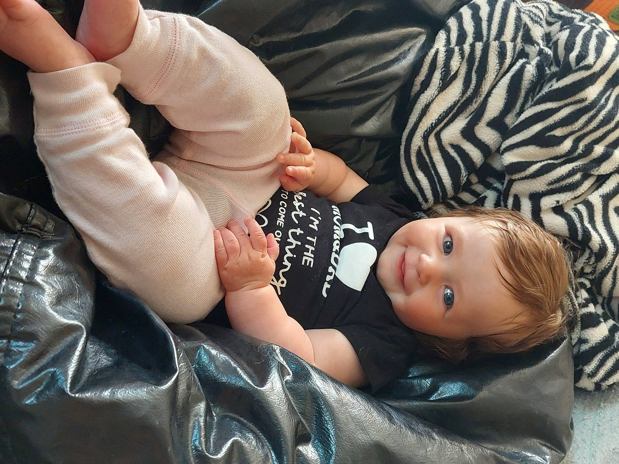 Kaylee joined the competition — help win amazing prizes! baby, baby_toddler_clothing, child, comfort, foot, fur, gesture, hat, joy, nail, person, sitting, sleeve, thumb, toddler, tree, wrist