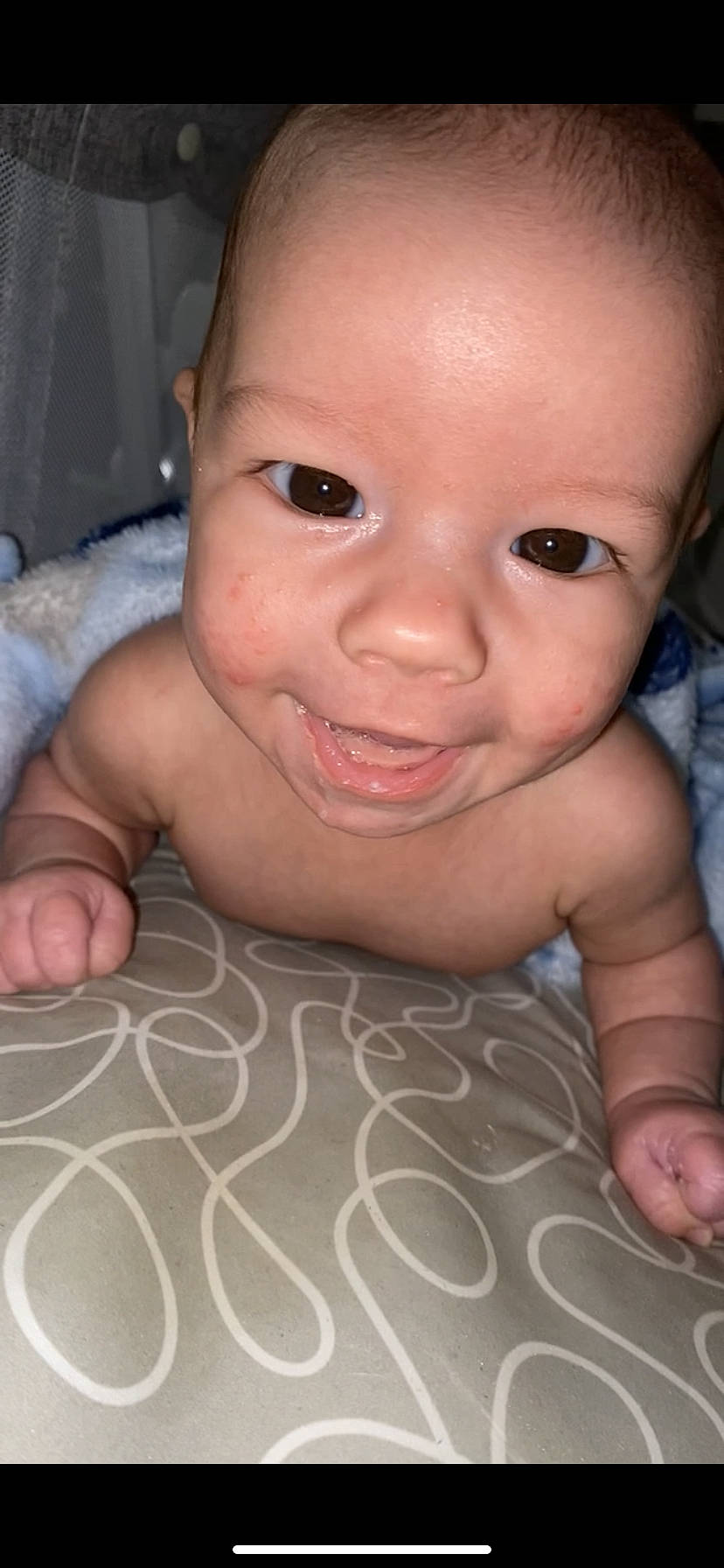 Madden is registered to the contest to win money with this photo: baby, cheek, crawling, ear, eyelash, finger, forehead, gesture, hand, human_body, iris, lip, mouth, neck, nose, person, pink, skin, smile, thumb