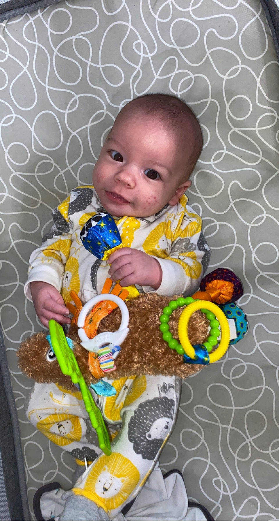 Madden joined the competition — help win amazing prizes! baby, baby_products, baby_toddler_clothing, baby_toys, cheek, child, eye, facial_expression, fun, happy, iris, orange, pattern, person, product, purple, room, sitting, skin, textile