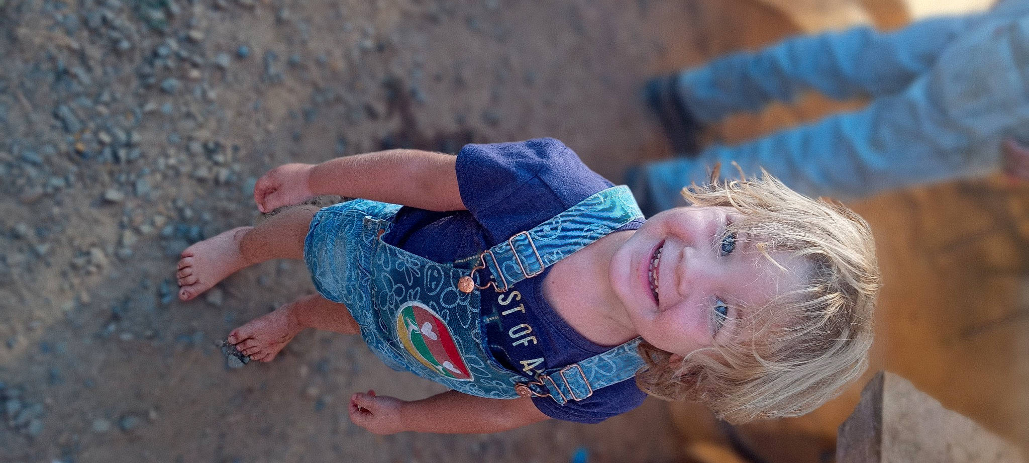 Madeline is registered to the contest to win money with this photo: beach, denim, electric_blue, eye, fashion_accessory, finger, fun, grass, hand, happy, human_leg, joy, landscape, leisure, nail, people_in_nature, person, recreation, smile, summer