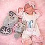 Kynzlee is registered to the contest to win money with this photo: newborn, baby, sleeping, pink, blanket, plush_toy, elephant, headband, flower, infant, soft, cute, cozy, child, clothing, resting, portrait, toddler, toy, peaceful