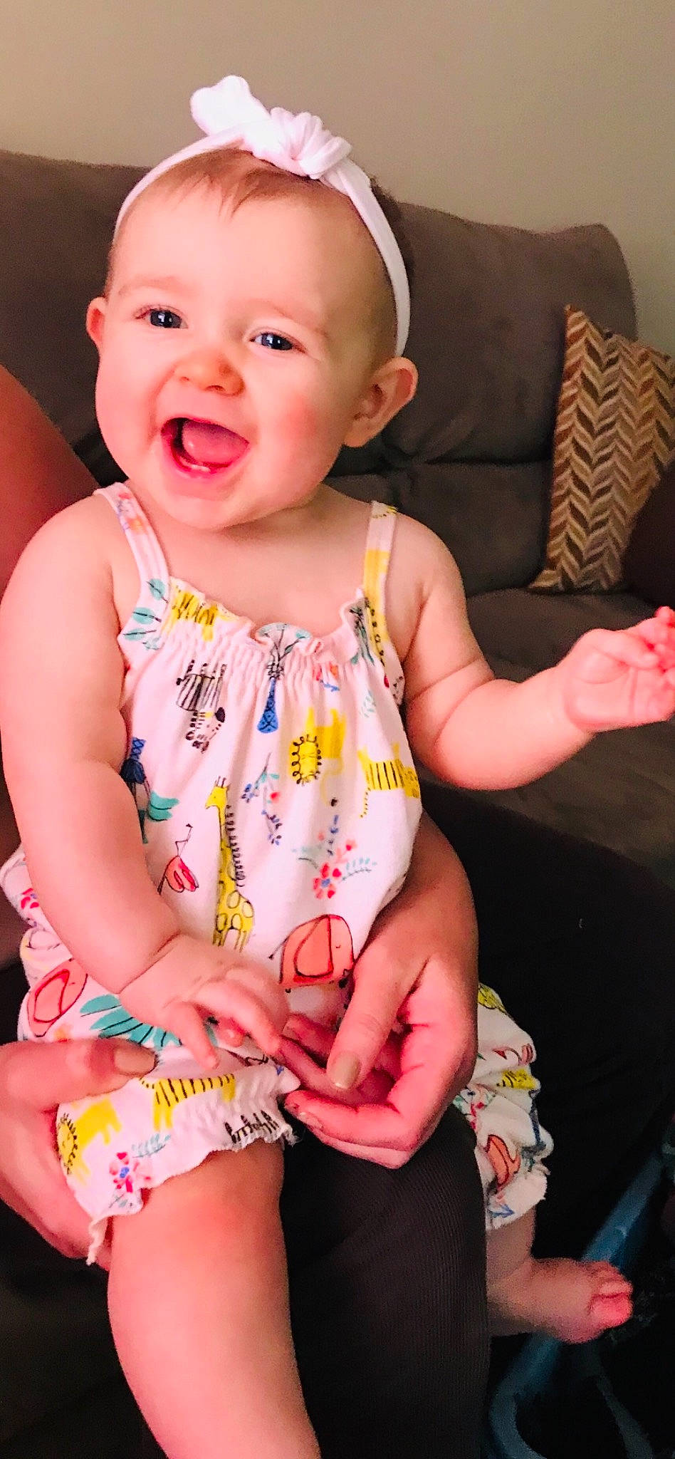 Aris is registered to the contest to win money with this photo: baby, baby_products, baby_toddler_clothing, beauty, cheek, child, dress, finger, neck, pattern, person, play, product, sitting, skin, smile, toddler