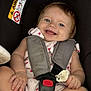 Joye a rejoint le concours — aidez-le/la à gagner de superbes lots ! baby, car_seat, child, smile, blue_eyes, pacifier, safety_harness, infant, cute, clothing, seatbelt, child_safety, happy, small_hands, small_feet, indoor, person, head, face, closeup