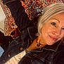 Mylo joined the competition — help win amazing prizes! woman, selfie, dog, couch, patterned_fabric, denim_jacket, silver_hair, smile, indoors, necklace, face, portrait, pet, casual_clothing, home, relaxed, seated, background, furniture, cozy