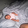 baby, bed, bedding, bedroom, blanket, child, closed_eyes, dark_skin, family, home, indoors, infant, lying_down, peaceful, photograph, pillow, pink_clothing, portrait, resting, sleeping