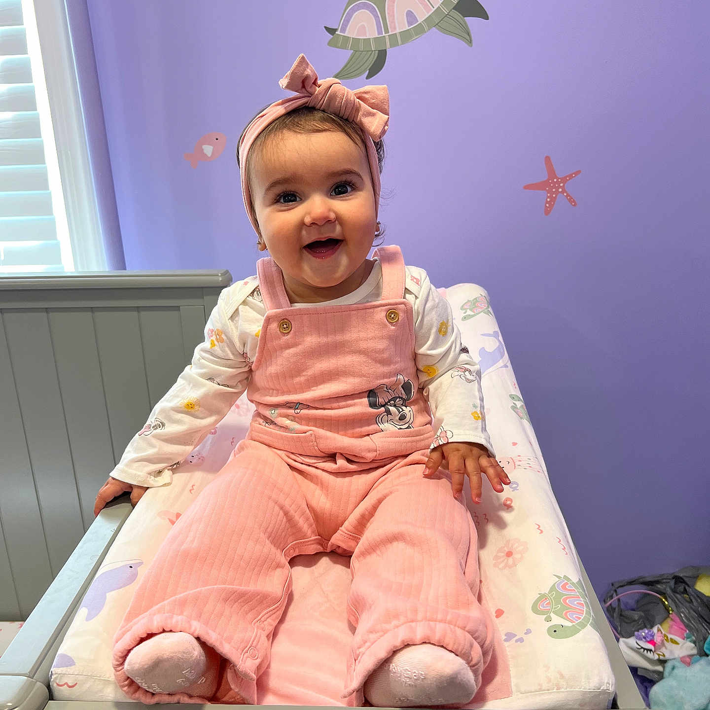 Mariella is registered to the contest to win money with this photo: accessories, baby, bag, bed, clothing, crib, face, furniture, handbag, head, hosiery, indoors, infantbed, nursery, person, photography, portrait, room, sock, toy