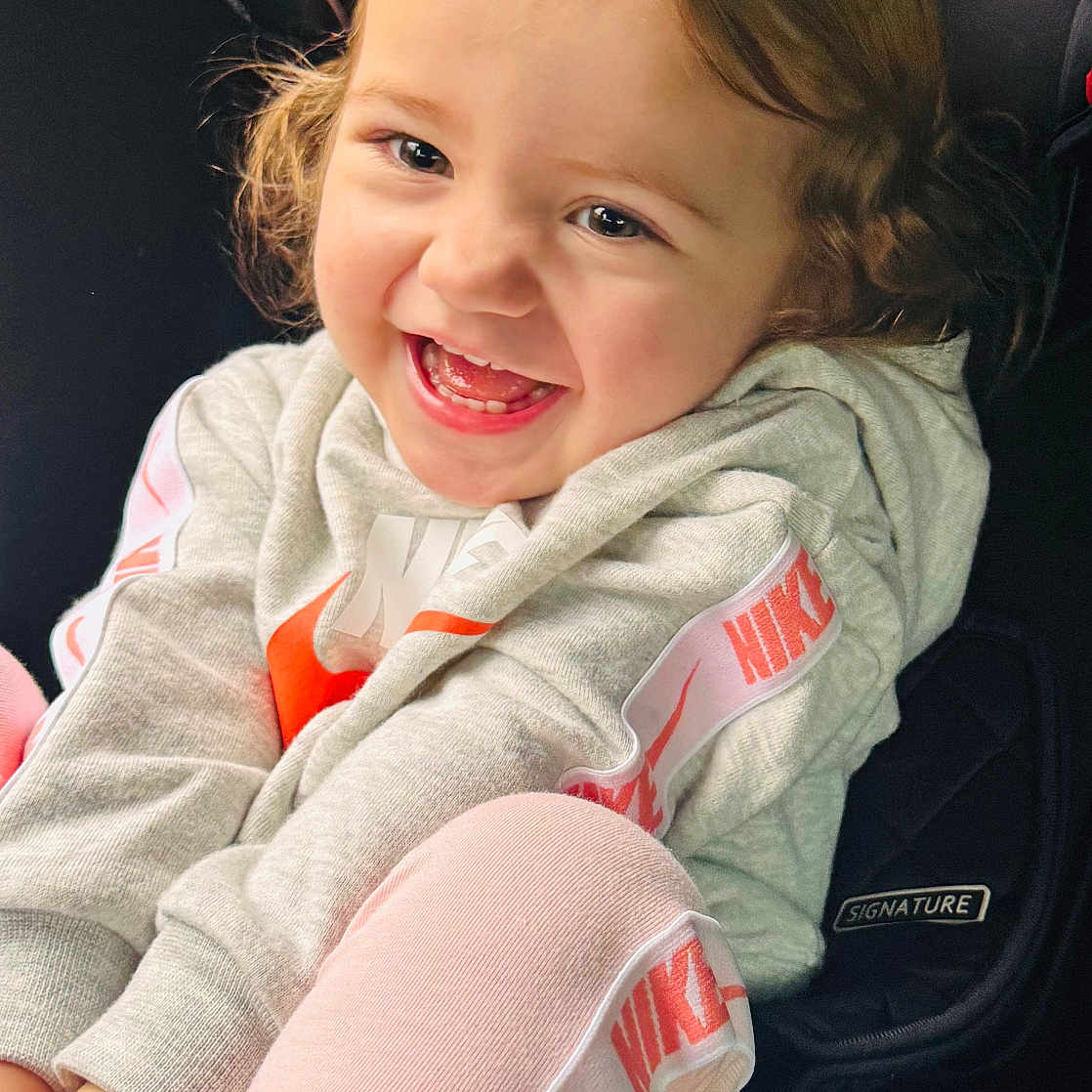 River-Blue is registered to the contest to win money with this photo: baby, babylaughing, bodypart, clothing, coat, cushion, face, happy, head, homedecor, jacket, laughing, mouth, pants, person, photography, portrait, sitting, smile, teeth