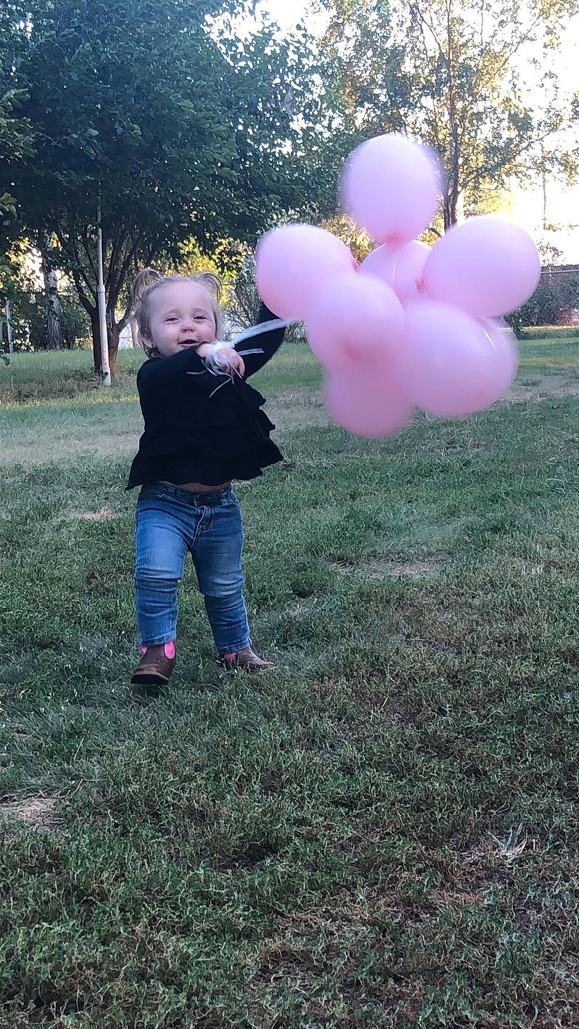 Payten joined the competition — help win amazing prizes! balloon, child, grass, party_supply, person, pink, yard