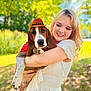 Duke joined the competition — help win amazing prizes! woman, dog, basset_hound, cowboy_hat, bandana, outdoor, park, greenery, smile, hugging, white_dress, long_hair, sunny, daylight, tree, grass, nature, pet, portrait, happy