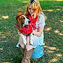 Duke is registered to the contest to win money with this photo: woman, dog, outdoor, grass, cowboy_hat, bandana, boots, white_dress, animal, pet, sitting, affection, nature, portrait, summer, casual, greenery, cute, companionship, leisure