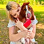 woman, dog, basset_hound, hat, bandana, outdoor, greenery, hug, white_dress, pet, cute, playful, tongue_out, summer, nature, grass, portrait, affection, animal, happy