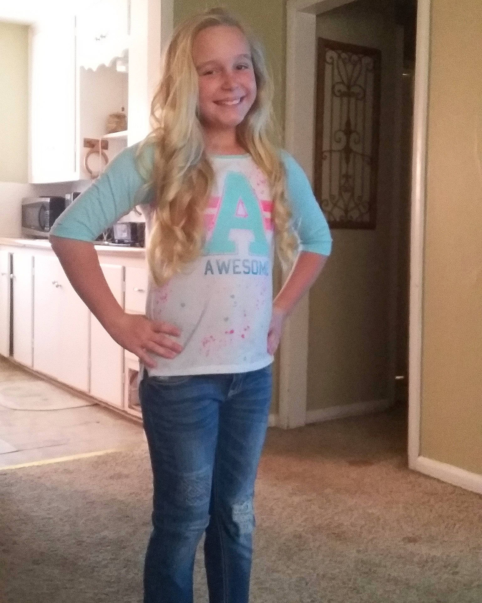 Brenna is registered to the contest to win money with this photo: blond, blue, clothing, day, denim, girl, hair, human_hair_color, jeans, joy, long_hair, outerwear, person, product, shoulder, socialite, standing, t_shirt, textile, top