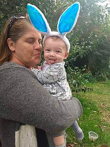 Dezmon is registered to the contest to win money with this photo: child, ear, easter, easter_bunny, grass, holiday, organ, outerwear, person, smile, toddler, turquoise