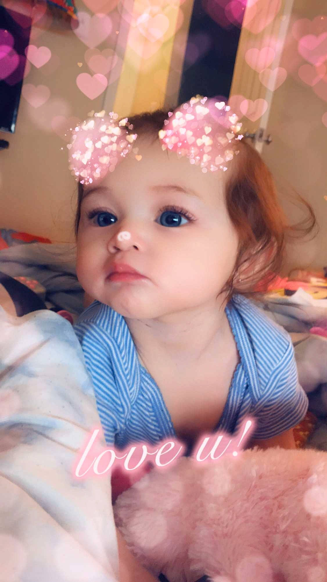 Kaitlynn is registered to the contest to win money with this photo: baby, beauty, cheek, child, child_model, eye, eyebrow, face, fashion_accessory, hair_accessory, happy, head, headband, headgear, headpiece, iris, person, pink, skin, smile