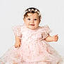 baby, child, girl, smiling, sitting, dress, pink, floral, headband, pearls, cute, portrait, infant, happy, barefoot, studio, white_background, cute_expression, fashion, adorable