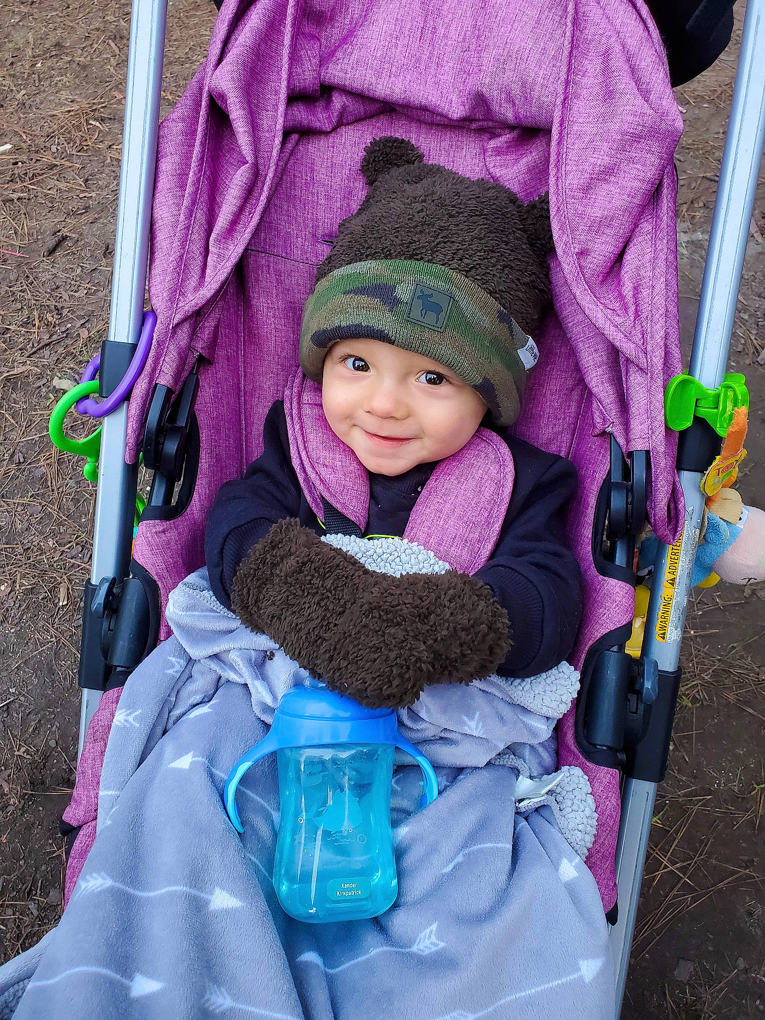Xander joined the competition — help win amazing prizes! baby, baby_carriage, baby_products, bag, blue, child, comfort, eye, face, green, headwear, joy, leisure, magenta, person, photograph, product, purple, recreation, smile
