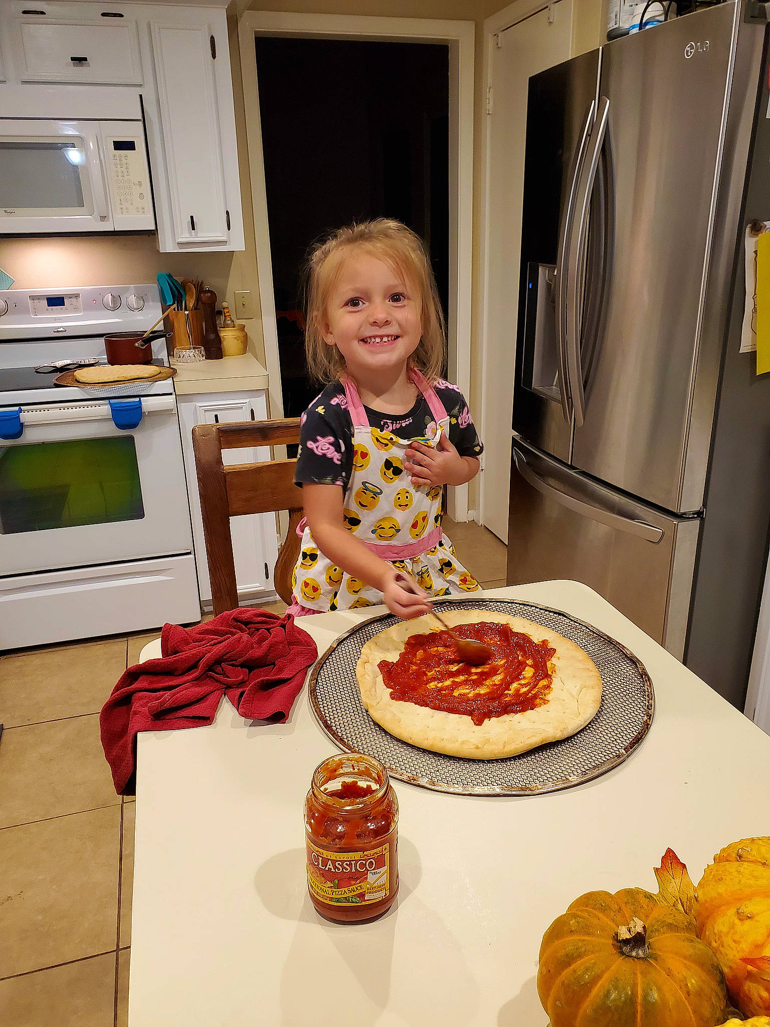 Kadence is registered to the contest to win money with this photo: cabinetry, calabaza, cucurbita, food, home_appliance, ingredient, joy, kitchen, kitchen_appliance, lekach, natural_foods, orange, person, plate, pumpkin, recipe, refrigerator, smile, table, tableware