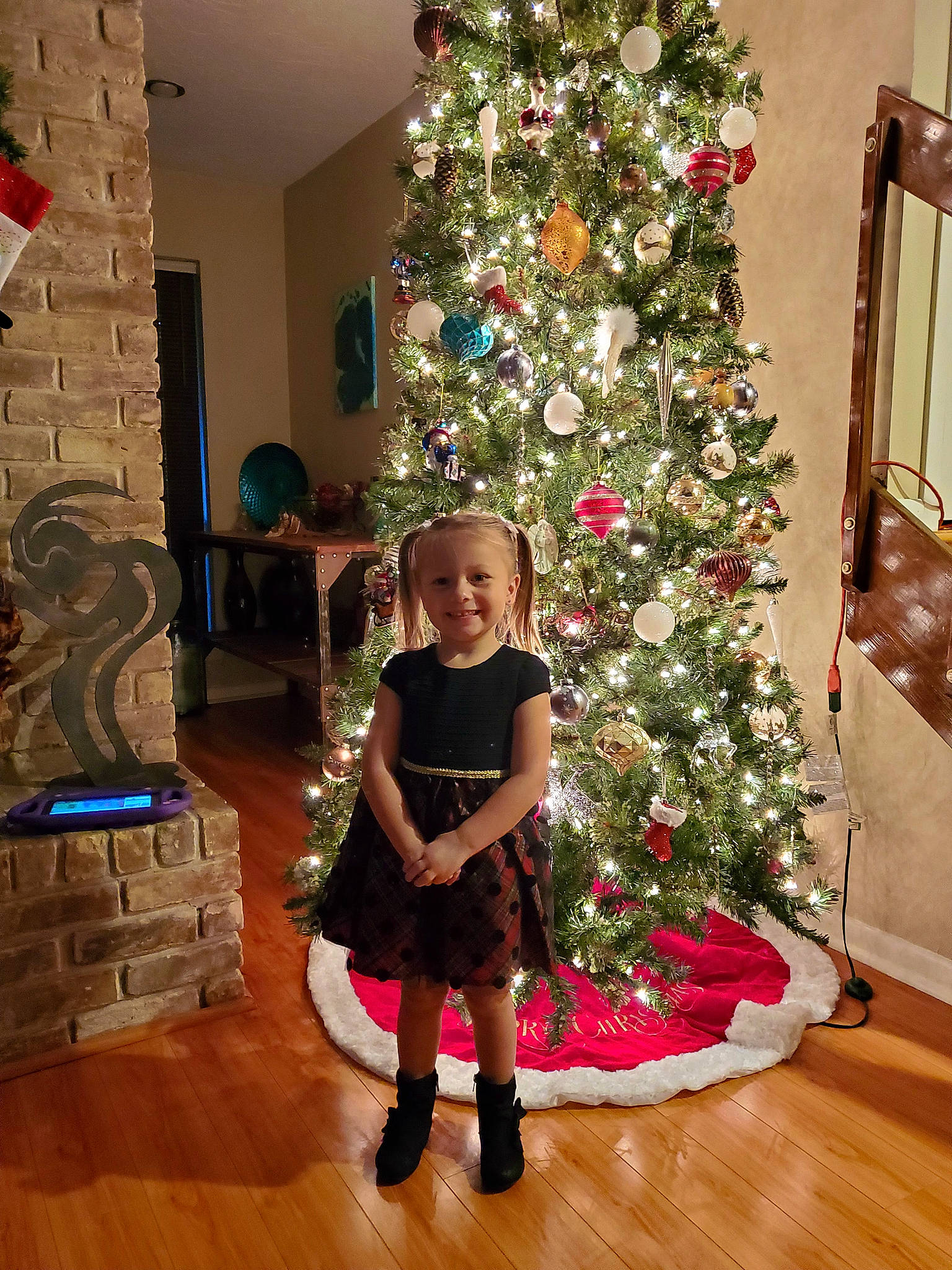 Kadence joined the competition — help win amazing prizes! christmas, christmas_decoration, christmas_eve, christmas_ornament, christmas_tree, event, flooring, hardwood, holiday, holiday_ornament, human_body, interior_design, joy, ornament, person, plant, smile, standing, tints_and_shades, toddler