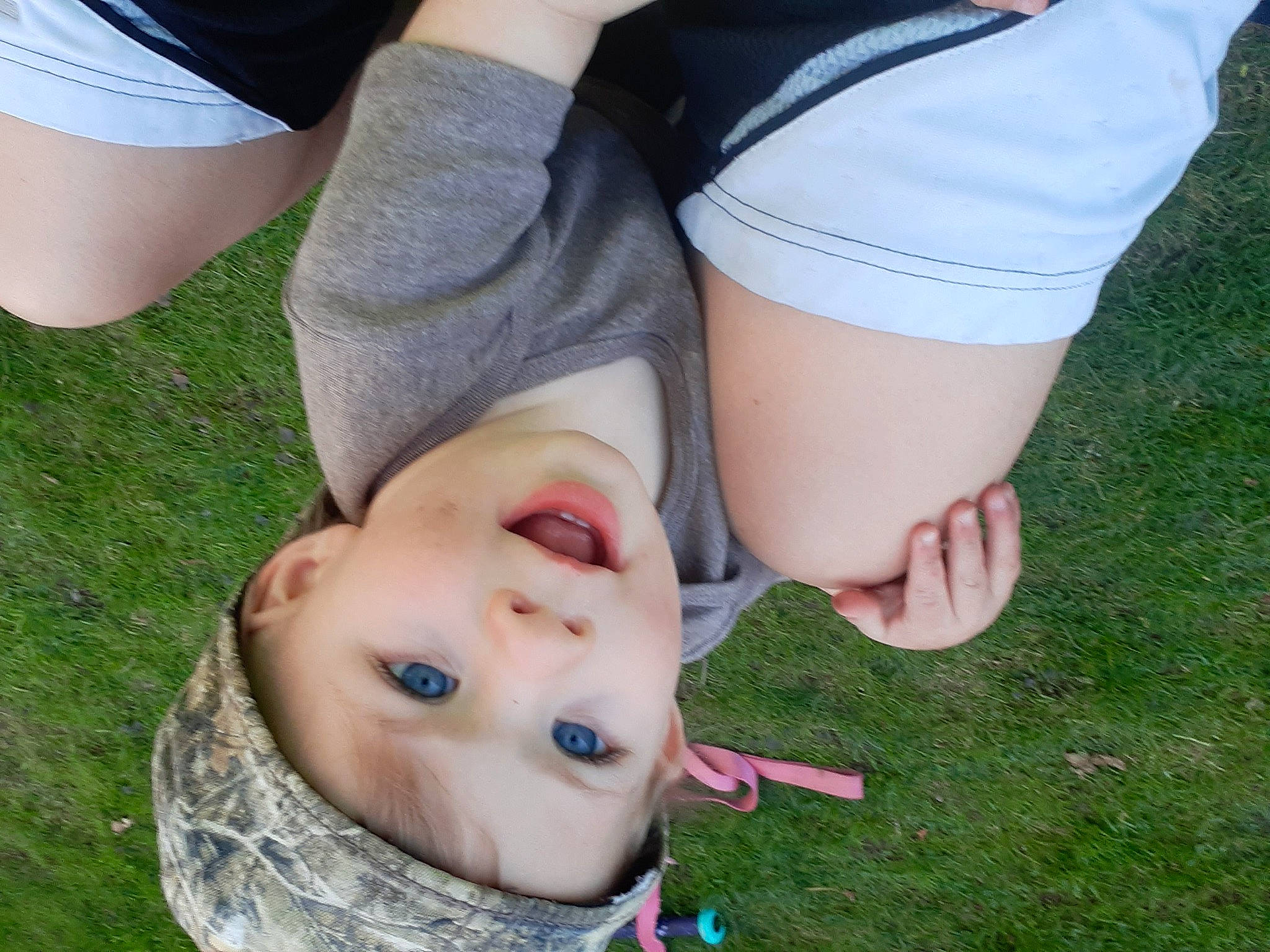 Deklyn is registered to the contest to win money with this photo: child, eye, fun, gesture, grass, grass_family, green, happy, hat, headwear, human_body, human_leg, knee, lawn, leisure, people_in_nature, person, plant, smile, thigh