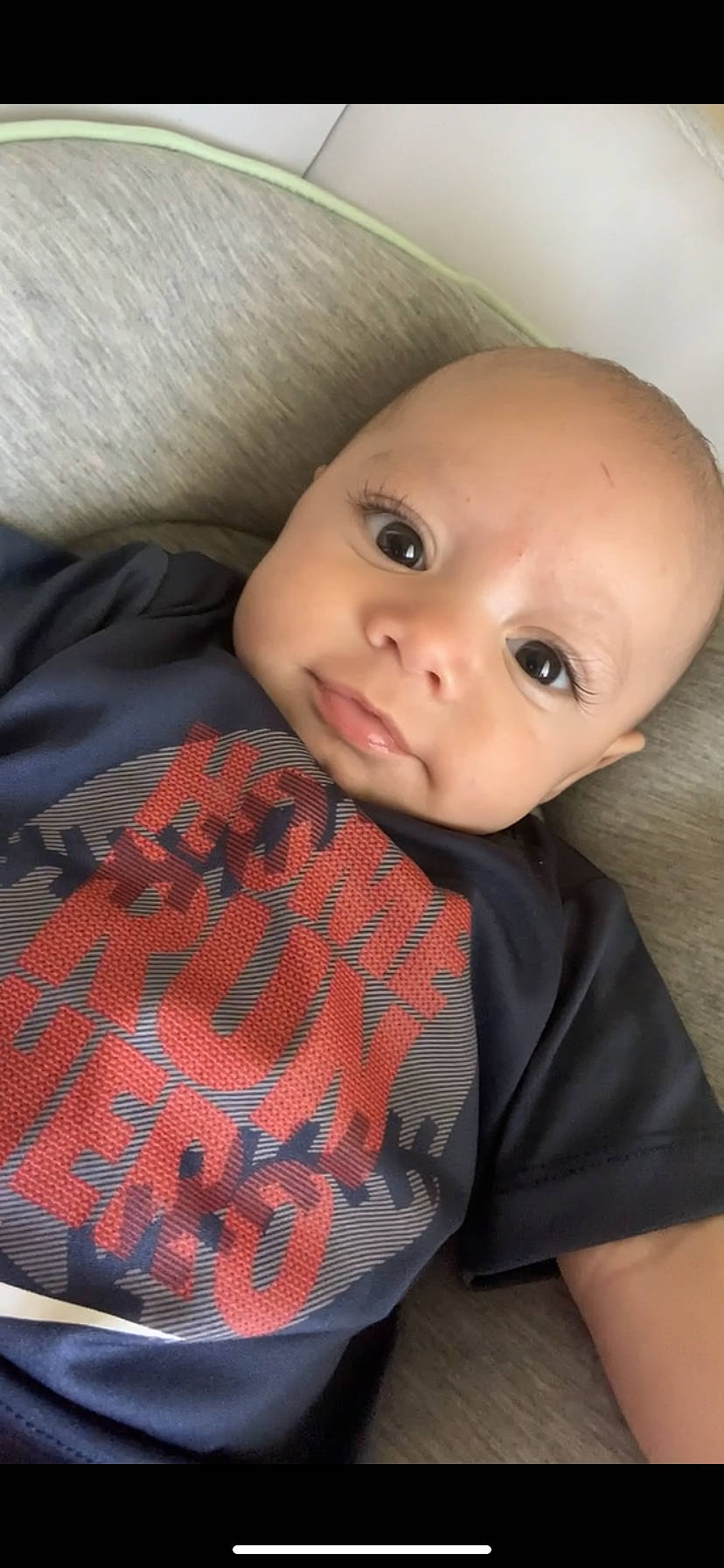 Hendrix Lee is registered to the contest to win money with this photo: baby, baby_toddler_clothing, carmine, cheek, child, comfort, flooring, iris, linens, lip, nose, pattern, person, plaid, skin, sleeve, smile, t_shirt, tartan, toddler