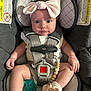 Ila Jayde is registered to the contest to win money with this photo: baby, car_seat, headband, pink_bow, infant, straps, pacifier, booties, safety_warning, cute, close_up, child, seated, indoors, adorable, soft_lighting, clothing, face, expression, small_hands