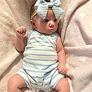 Ila Jayde joined the competition — help win amazing prizes! baby, infant, bow, headband, striped_clothing, blue, pink_blanket, polka_dots, soft_texture, fist, legs, cute, portrait, child, newborn, sitting, indoors, clothing, fabric, person