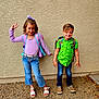 Mathias joined the competition — help win amazing prizes! child, girl, boy, smile, peace_sign, backpack, casual_clothing, jeans, sandals, sneakers, outdoor, wall, gravel, playful, happy, posing, friends, short_hair, long_hair, colorful