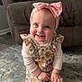 accessories, baby, babylaughing, clothing, couch, cushion, dress, face, furniture, happy, hat, head, headband, homedecor, pants, person, photography, portrait, sitting, smile