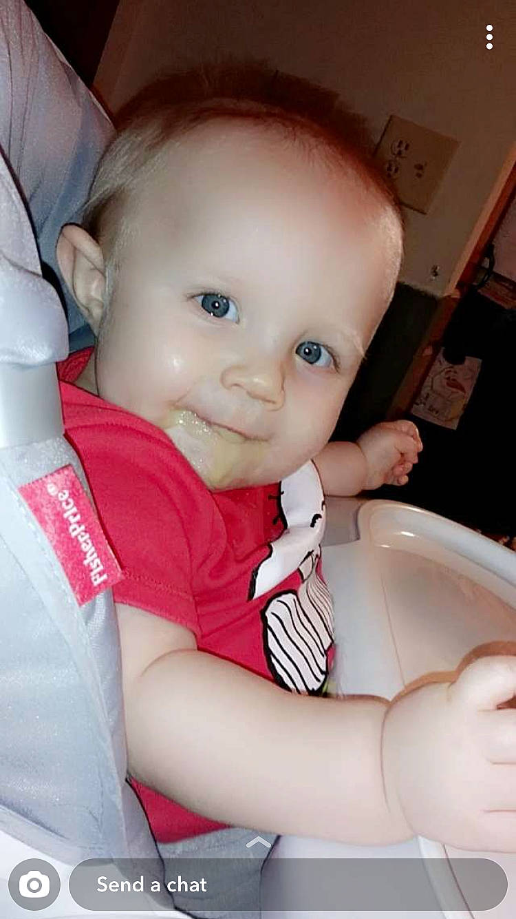 Deacon is registered to the contest to win money with this photo: arm, baby_toddler_clothing, cheek, chin, eyebrow, eyelash, finger, flash_photography, gesture, hand, happy, iris, joint, lip, mouth, neck, nose, person, product, skin