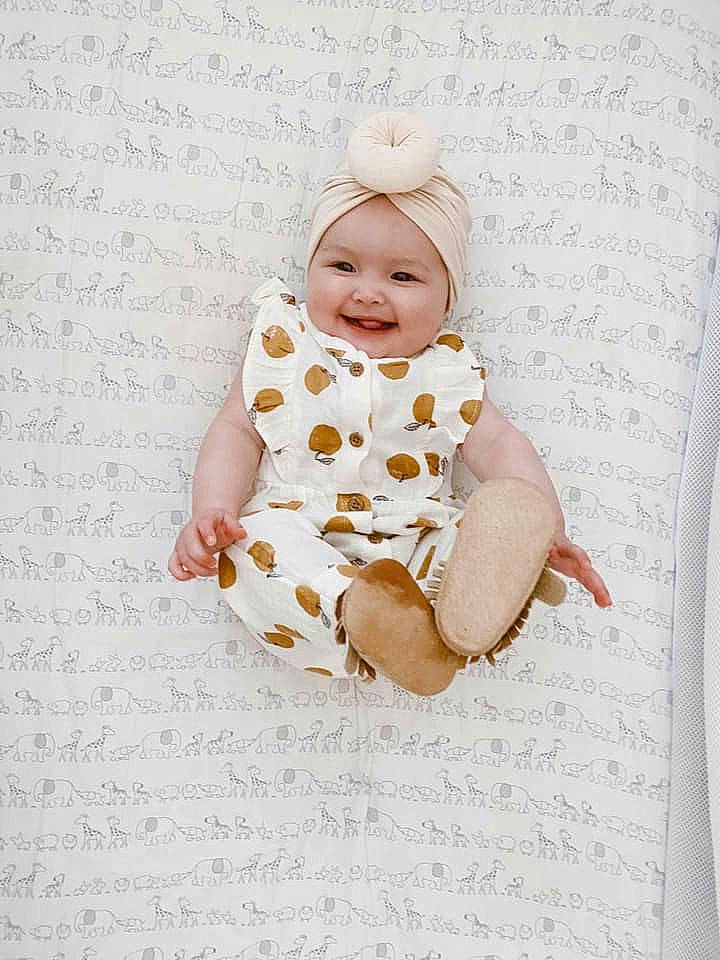 Kehlani is registered to the contest to win money with this photo: baby, baby_products, baby_toddler_clothing, child, font, happy, headwear, joy, pattern, peach, person, pink, portrait_photography, product, sitting, sleeve, smile, toddler