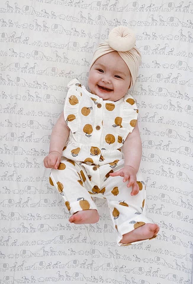 Kehlani is registered to the contest to win money with this photo: baby, baby_toddler_clothing, child, font, gesture, happy, headwear, joy, linens, pattern, peach, person, portrait_photography, sleeve, smile, textile, thumb, toddler
