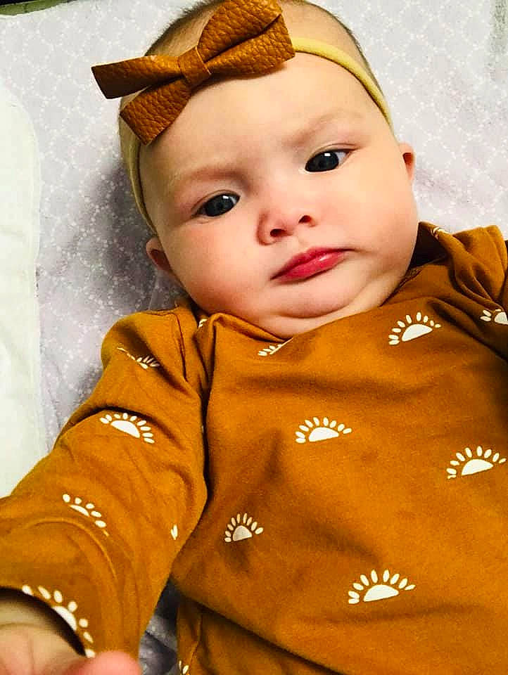 Kehlani is registered to the contest to win money with this photo: baby, baby_toddler_clothing, cap, cheek, chin, costume_hat, eye, face, gesture, hairstyle, happy, hat, head, headwear, human_body, nose, orange, person, skin, sleeve