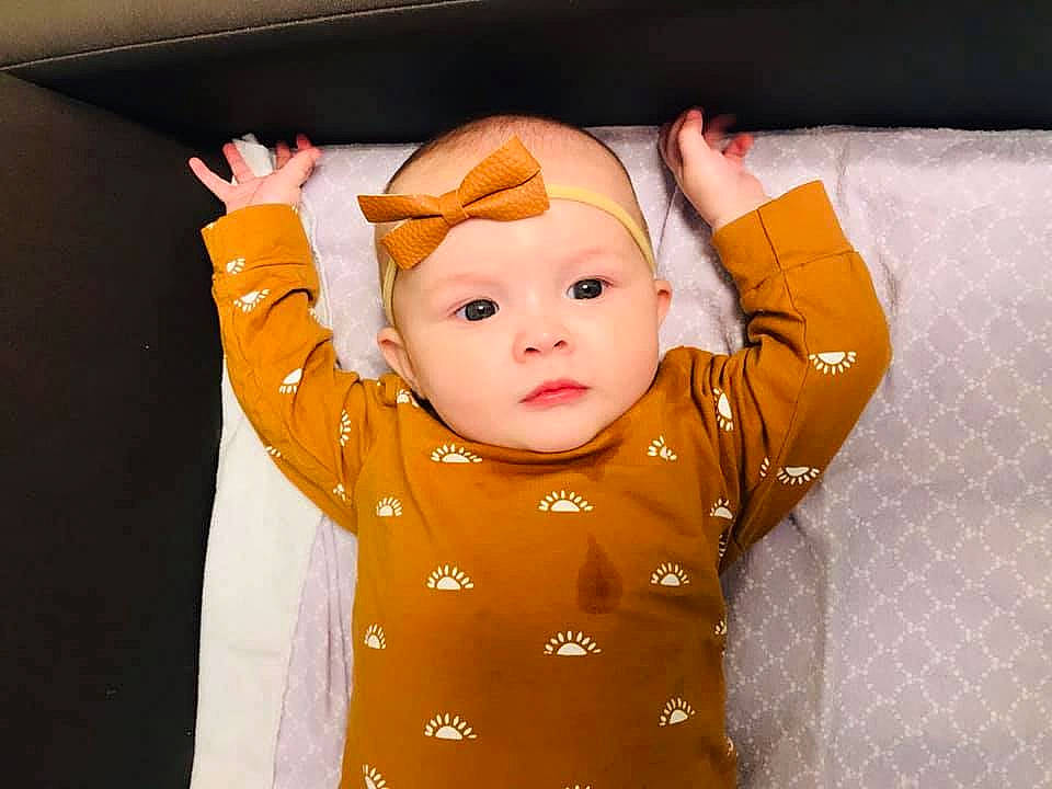 Kehlani joined the competition — help win amazing prizes! baby, baby_sleeping, baby_toddler_clothing, cheek, child, comfort, ear, face, fun, gesture, happy, head, headgear, headwear, orange, peach, person, portrait_photography, room, sleeve