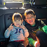 Ava Worasen joined the competition — help win amazing prizes! back_seat, black_shirt, car_interior, casual_clothing, child, children, faces, finger_pose, gray_shirt, happy, playful, portrait, road_trip, seatbelt, siblings, smiling, sunlight, vehicle, young_boy, young_girl