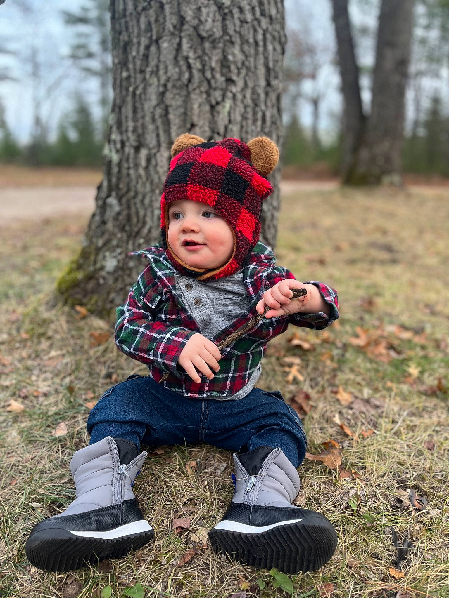 Brady joined the competition — help win amazing prizes! baby, baby_toddler_clothing, boot, cap, child, eye, face, grass, happy, head, headwear, landscape, pattern, people_in_nature, person, plaid, plant, sneakers, tartan, toddler