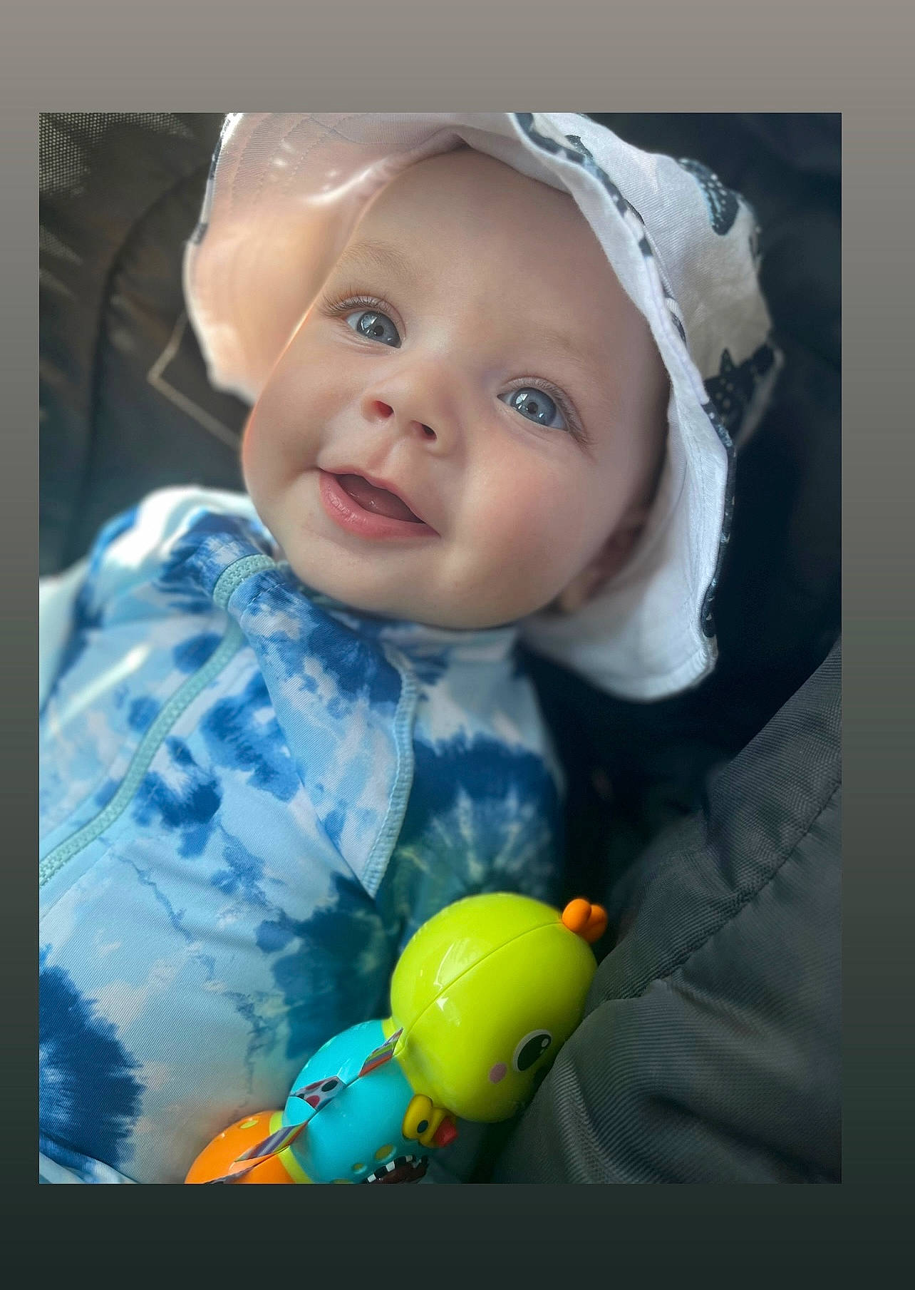 Tyrant is registered to the contest to win money with this photo: art, baby, baby_laughing, baby_products, baby_toddler_clothing, cheek, child, cool, dress, electric_blue, fashion_accessory, flash_photography, fun, happy, hat, headwear, iris, nose, pattern, person