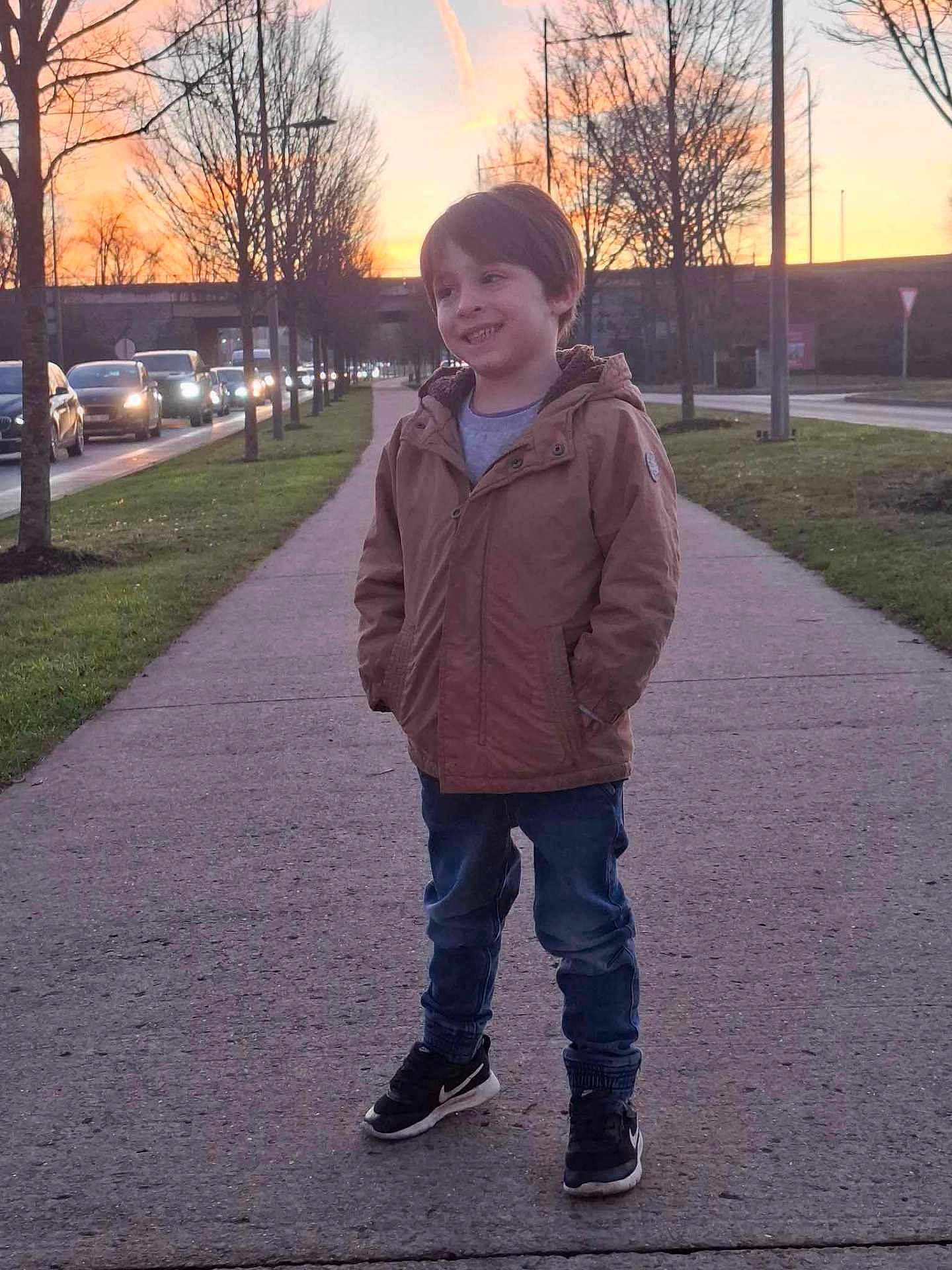Kyo G participe au concours pour gagner de l'argent avec cette photo : boy, child, city, clothing, coat, face, grass, head, jacket, jeans, male, pants, path, person, photography, plant, portrait, sidewalk, standing, walking