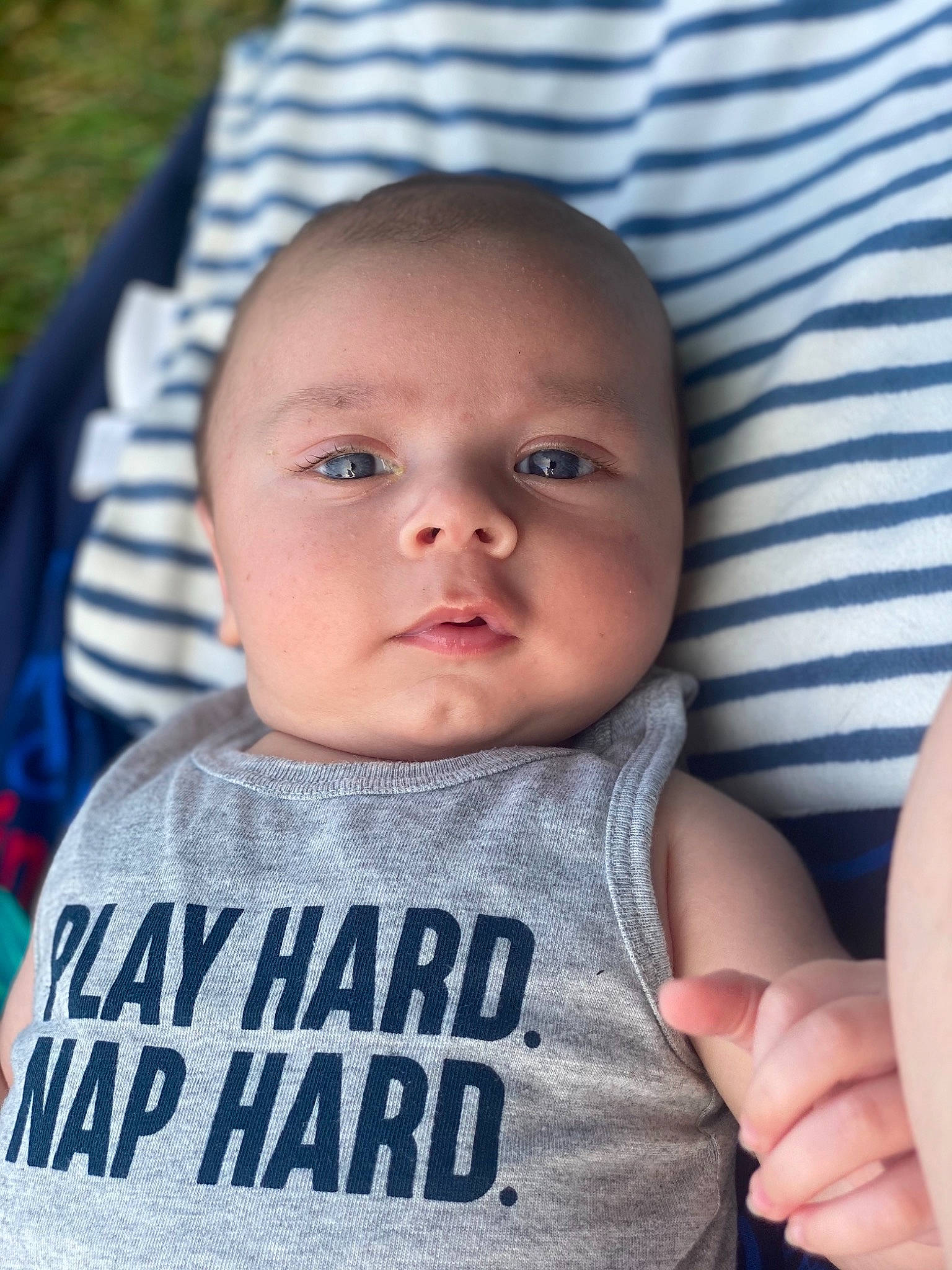 Bennett is registered to the contest to win money with this photo: baby, baby_toddler_clothing, cheek, chin, eye, eyebrow, face, facial_expression, finger, gesture, happy, head, iris, lip, mouth, nose, person, skin, sleeve, t_shirt