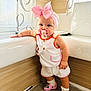 toddler, child, baby, pacifier, pink_bow, headband, indoor, bathroom, bathtub, white_clothing, pink_shoes, crocs, socks, wood_paneling, curtains, window, standing, cute, fashion, accessories