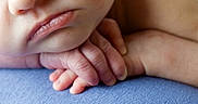 Lorelai is registered to the contest to win money with this photo: baby, blue_surface, child, close_up, cute, detail, face, hands, human, infant, lips, newborn, peaceful, portrait, resting, skin, sleepy, small_fingers, softness, texture