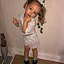 Mya participe au concours pour gagner de l'argent avec cette photo : black_shoes, child, curious_expression, floor, girl, home_interior, indoor, pastel_clothing, person, pigtails, plant, playful_pose, shirt, shorts, sneakers, socks, standing, toy_vacuum, wall, wooden_floor