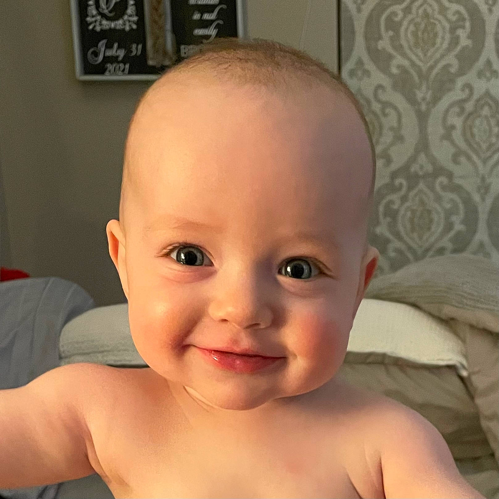 Trace is registered to the contest to win money with this photo: arm, baby, cheek, ear, eyebrow, eyelash, forehead, gesture, hand, head, human_body, iris, joy, lip, mouth, muscle, neck, nose, person, picture_frame