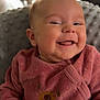 Victoire participe au concours pour gagner de l'argent avec cette photo : baby, smiling, infant, pink_clothing, sunflower_design, happy, cozy, blanket, indoor, portrait, cute, child, soft_light, closeup, face, cheeky, hands, texture, warm, comfortable
