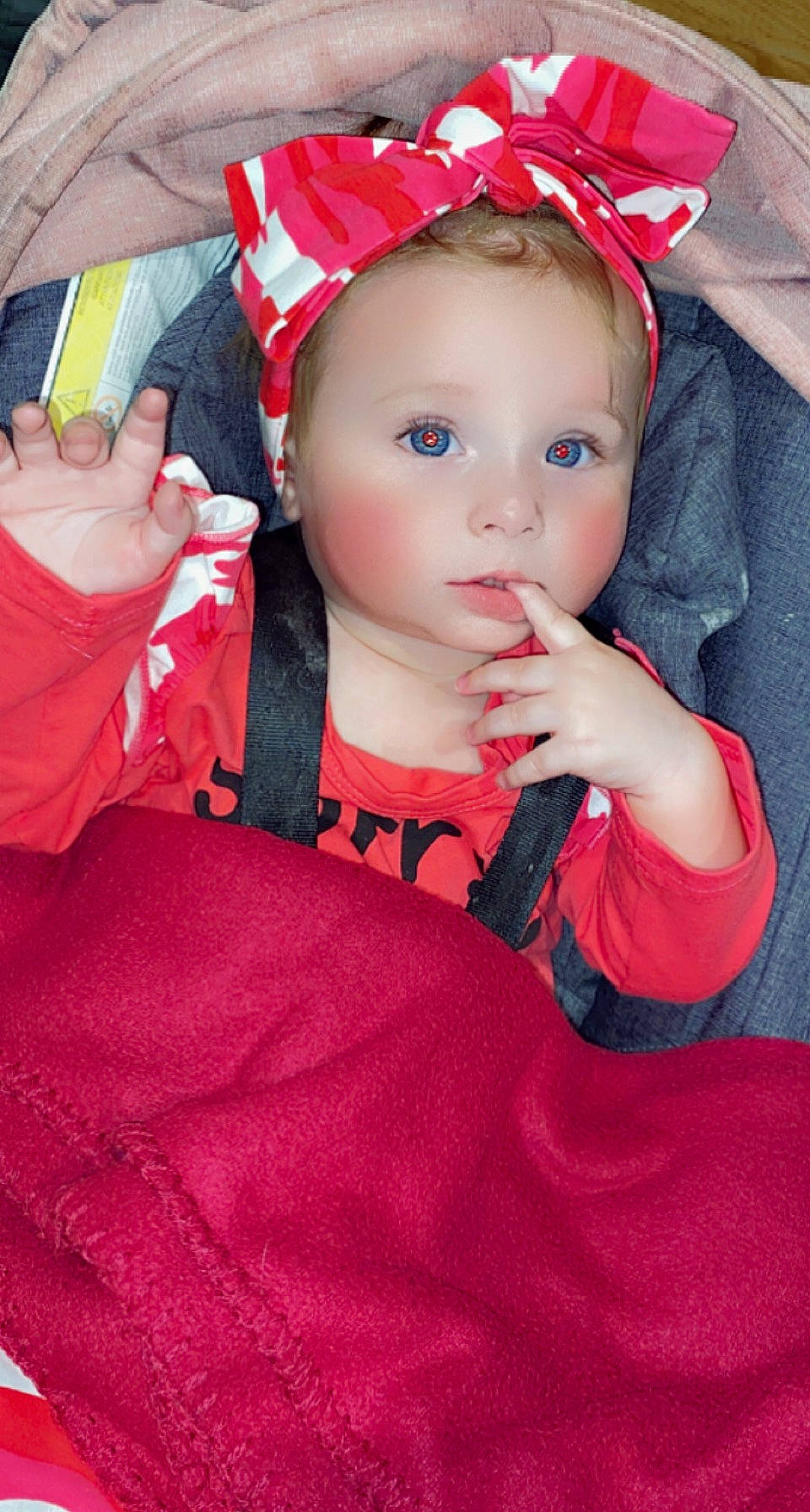 Syliana participe au concours pour gagner de l'argent avec cette photo : baby, baby_products, baby_toddler_clothing, cap, child, costume_hat, dress, eyelash, fashion_accessory, hair_accessory, headband, helmet, lip, magenta, nail, person, pink, red, sleeve, thumb