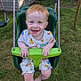 Hudson joined the competition — help win amazing prizes! toddler, child, swing, playground, outdoor, grass, smiling, happy, red_hair, blue_eyes, summer_clothes, backyard, fence, toy, seat, play, nature, casual, fun, daylight