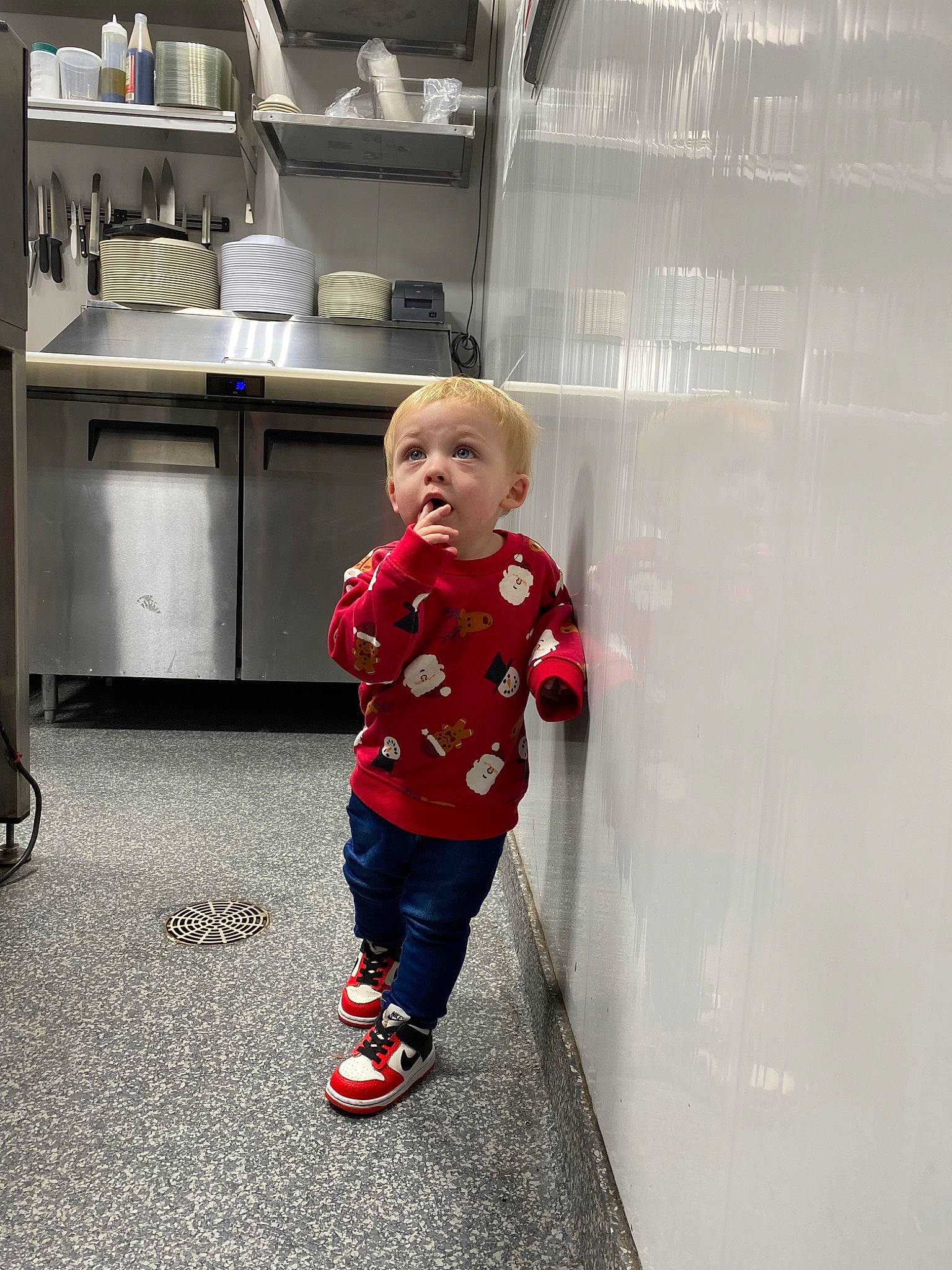 Major is registered to the contest to win money with this photo: baby_toddler_clothing, cabinetry, child, cooktop, countertop, flooring, gas, gas_stove, home_appliance, human_leg, kitchen, kitchen_appliance, kitchen_stove, knee, pattern, person, play, sleeve, stove, surprise