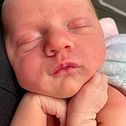 Athena is registered to the contest to win money with this photo: newborn, baby, sleeping, face, skin, hand, infant, closeup, peaceful, cute, resting, portrait, child, soft, human, young, person, natural_light, pink, delicate