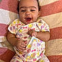 Kaiairi joined the competition — help win amazing prizes! baby, infant, smile, happy, onesie, colorful_clothing, pattern, cartoon, fruit, rainbow, butterfly, blanket, striped, soft_texture, cute, child, lying_down, hand, face, portrait